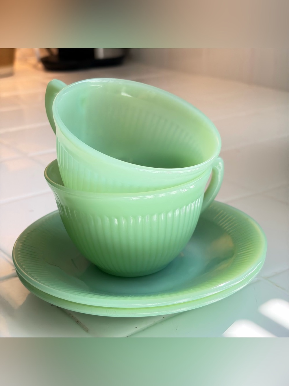 Set of jadeite teacups and saucers